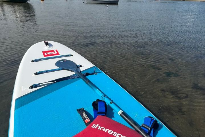 a close up of a boat next to a body of water