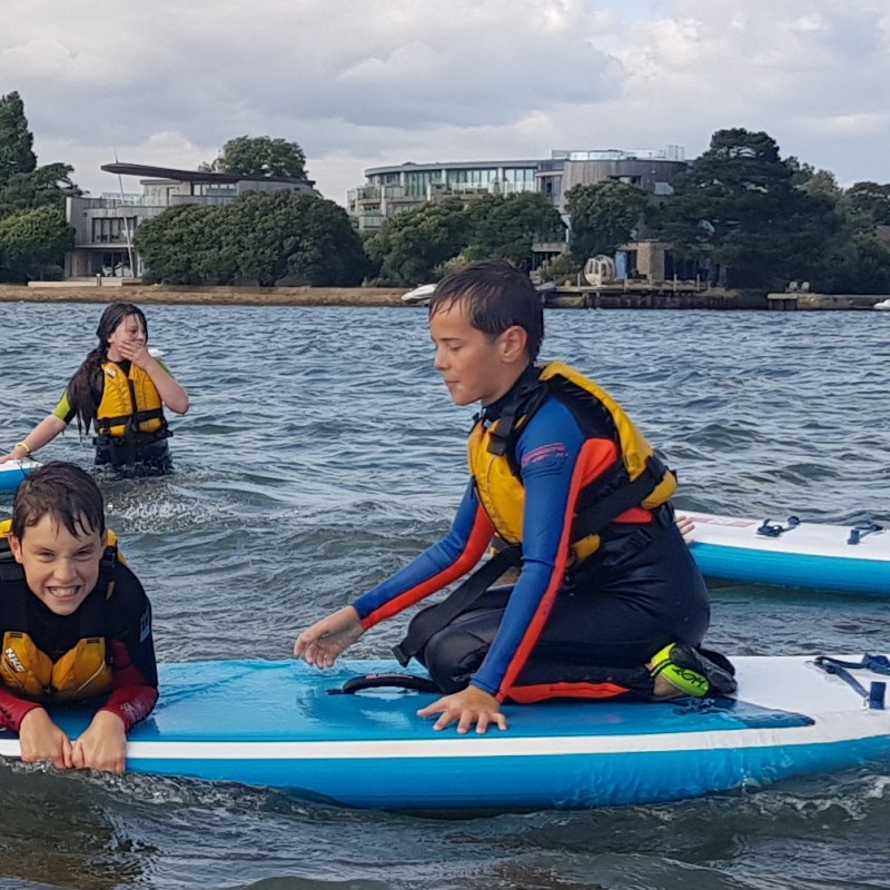 a group of people on a boat in the water