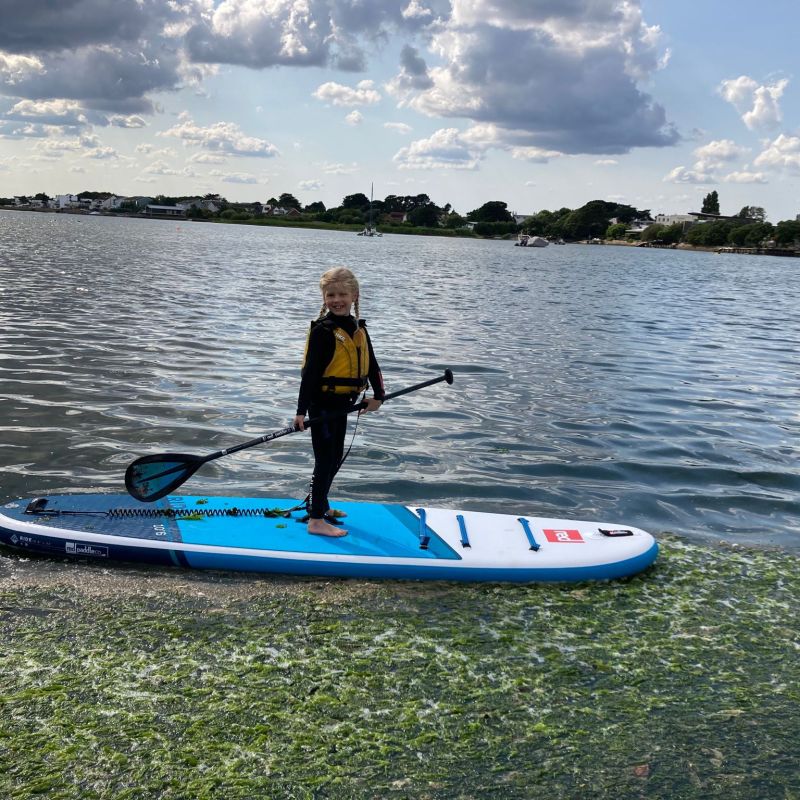 a man rowing a boat in a body of water
