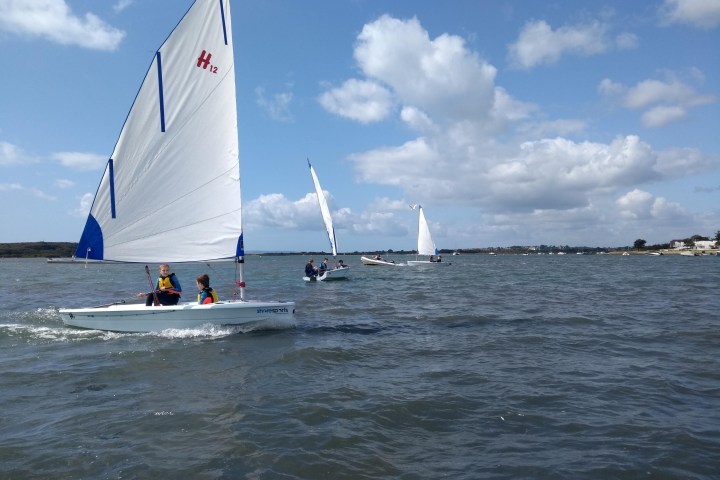 a group of people on a boat in a body of water