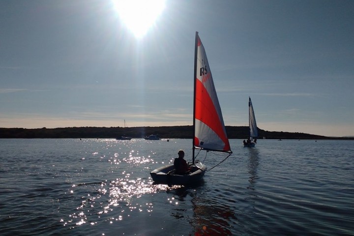 a small boat in a large body of water