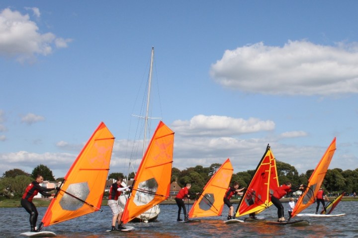 a group of people on a boat in the water