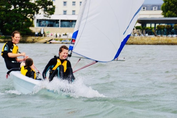 a group of people riding on the back of a boat